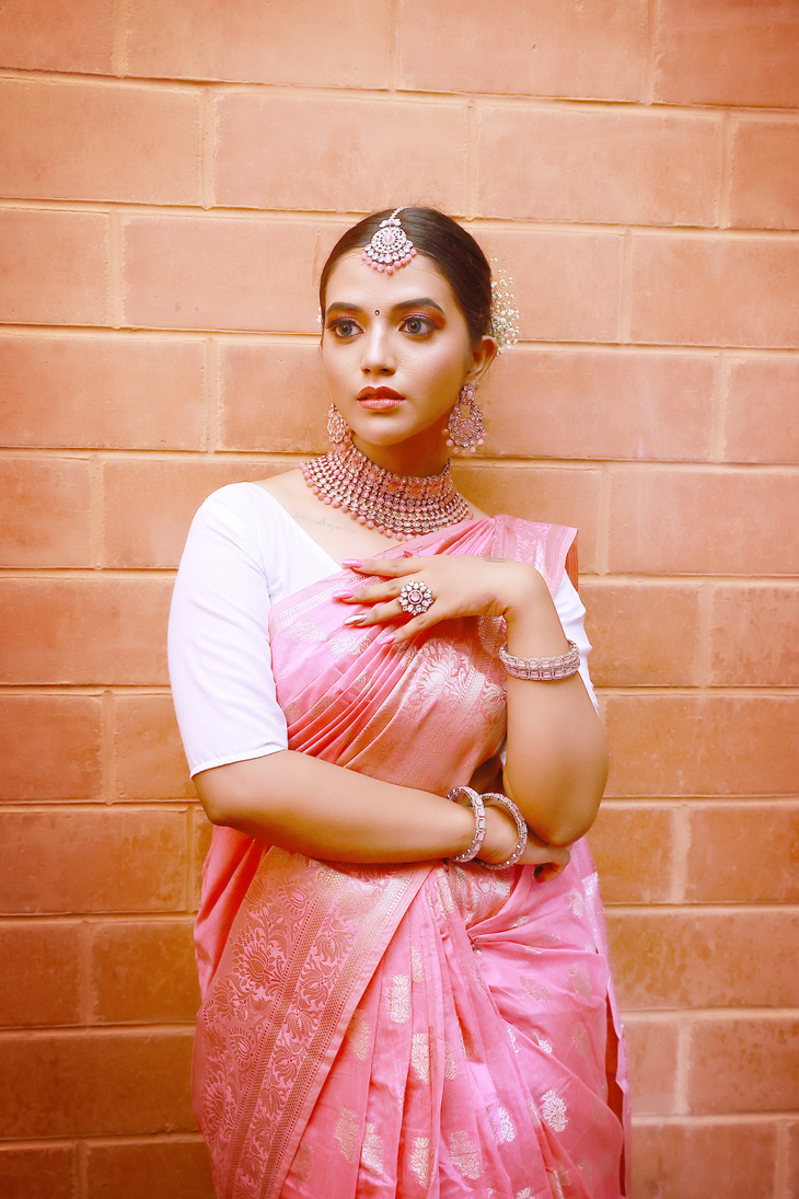 A Woman in Pink and White Saree Dress